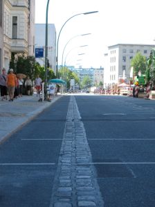 Two rows of bricks in the pavement mark the location of the Berlin Wall.