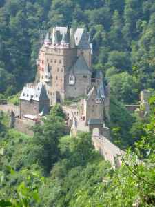 Burg Eltz sits high atop a rock outcrop, nestled in a loop in the Eltz River.